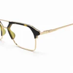 Close-up of Lenstick black gold geometric eyeglasses frame detail