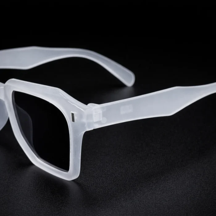 Matte clear square sunglasses temple detail transparent frame close up left